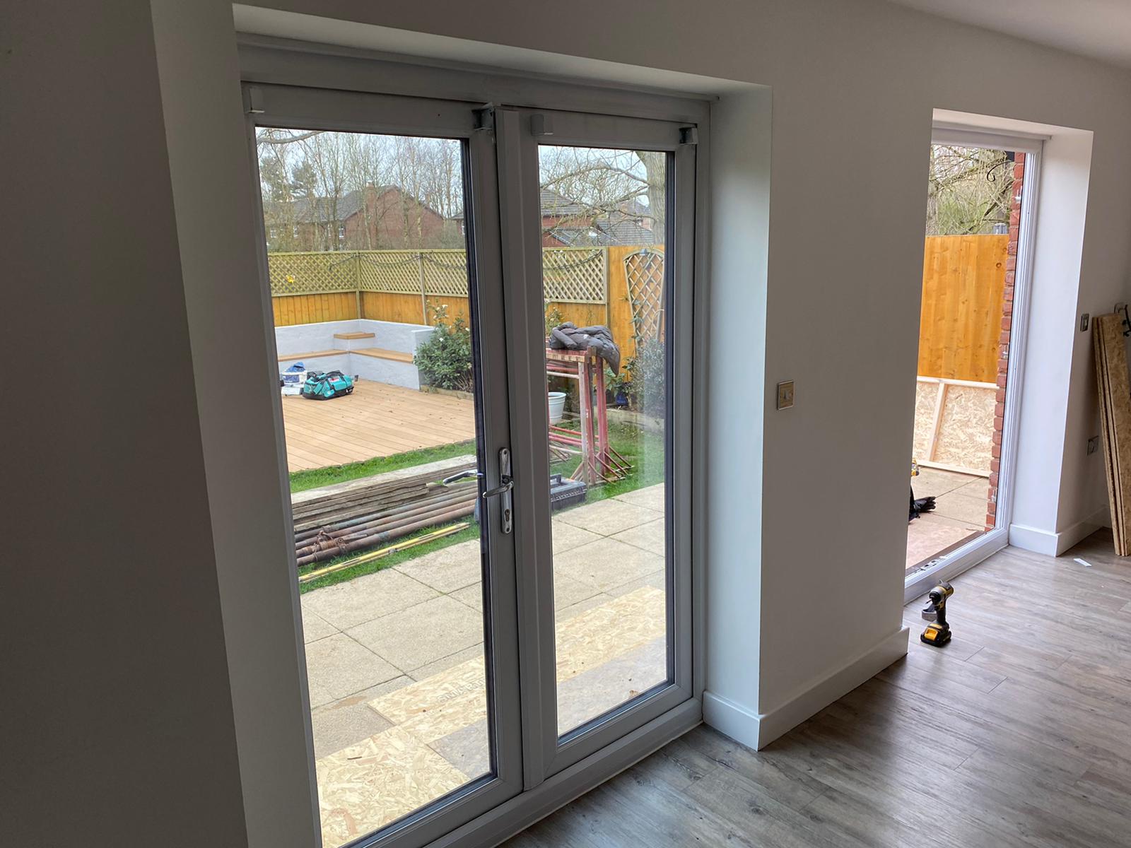 Grey glazed doors fitted in a hallway
