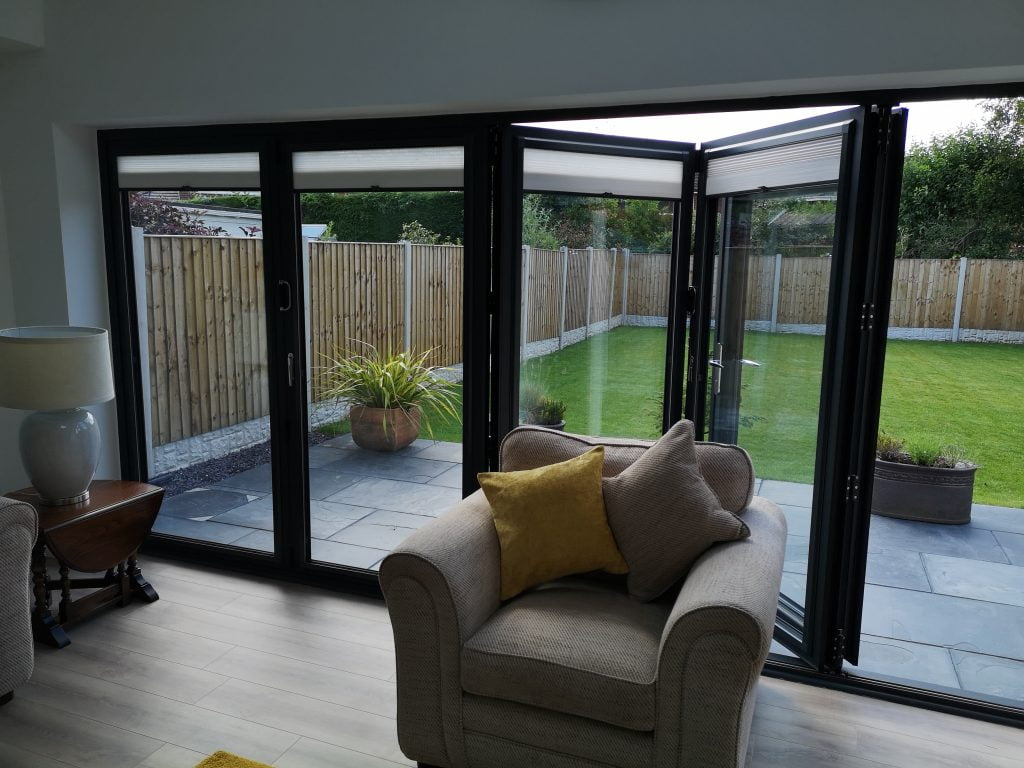 Bi-fold doors viewed from a living room looking onto the garden