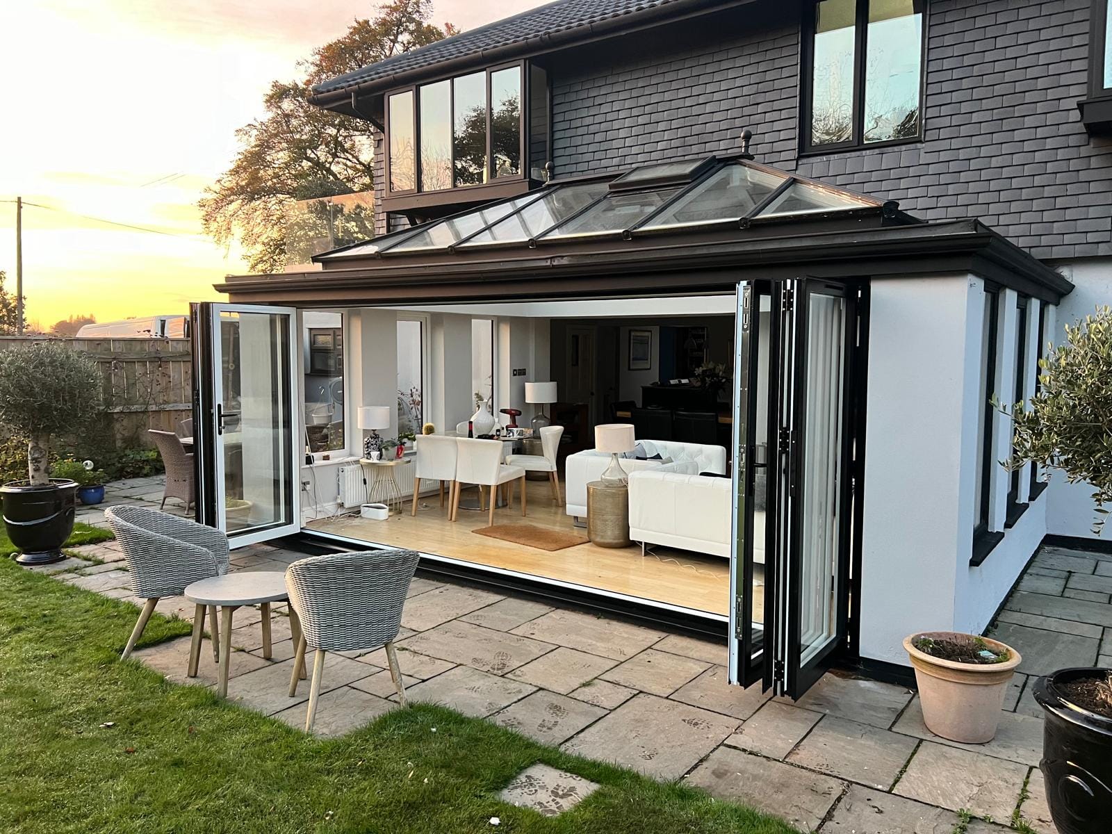 Anthracite grey bi-fold doors fitted to a rear extension